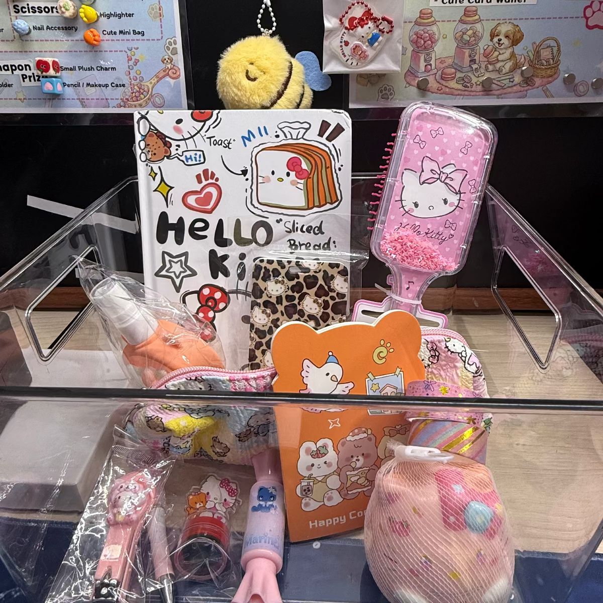 Get 10 Mystery Capsules in Hello Kitty Theme including makeup pouch, stamp, fairy headband, diary book, key charm. card holder, squishy, beaded pen, and spray bottle