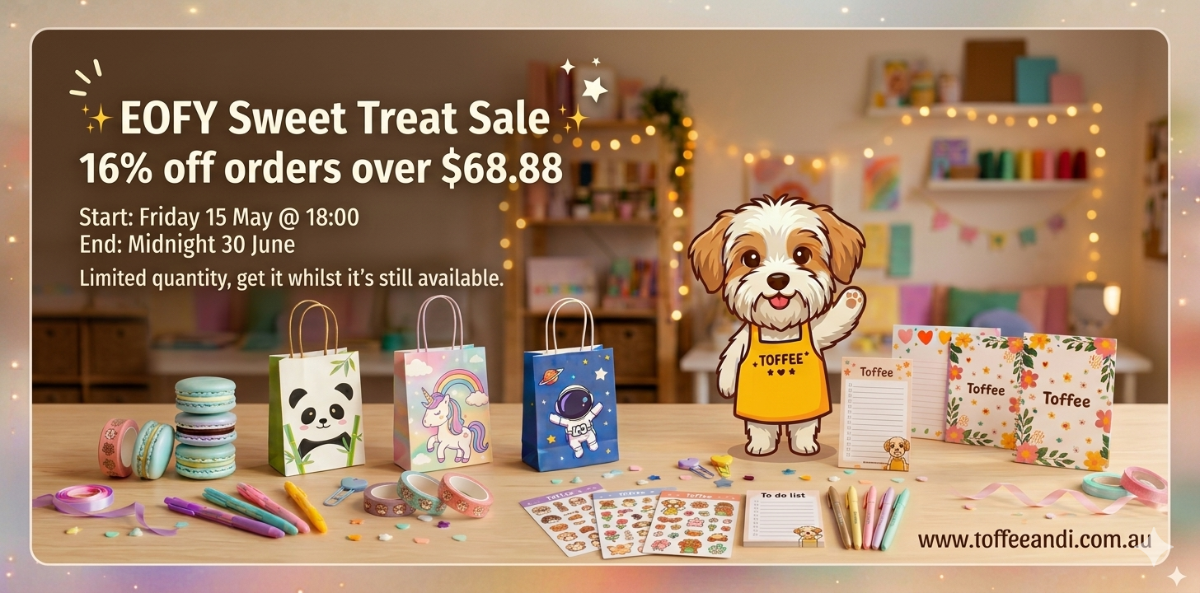 Shopify hero banner for Toffee & Co. EOFY Sweet Treat Sale featuring a cute dog mascot next to pastel panda, unicorn, and astronaut gift bags, stationery, and colorful macarons on a wooden table with a soft, fairy-lit room background.