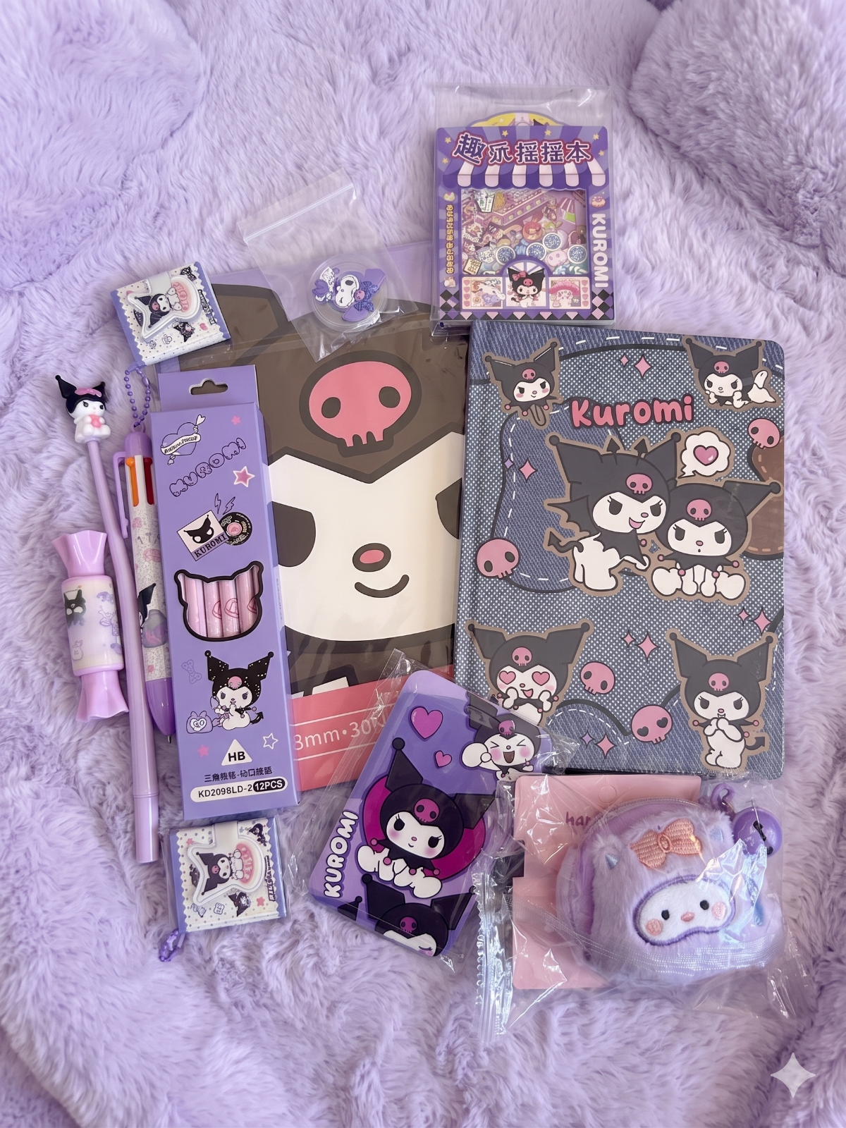 Collection of Kuromi-themed stationery items such as  on a soft purple such as stamp, box of pencil, wacky pen, multicolor pen, card holder, hardcover notebook, diary book, coin purse, and gachapon notebook.