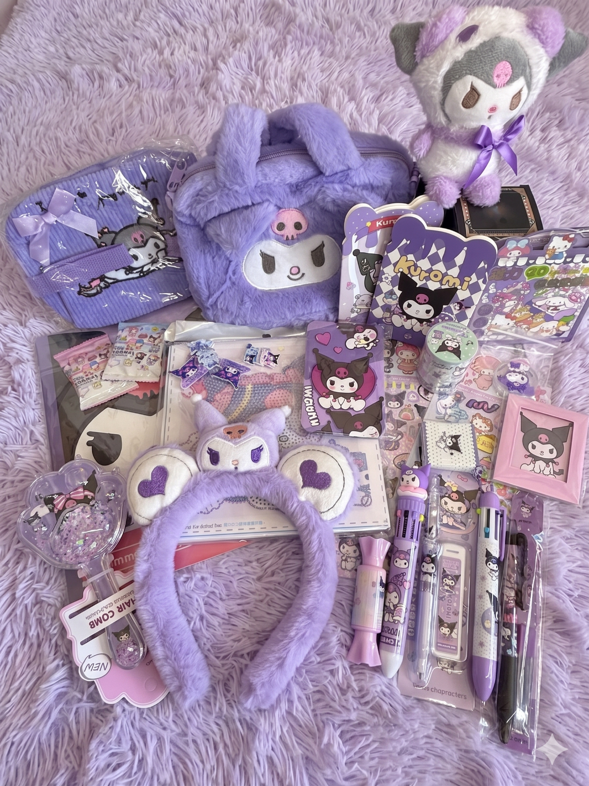 Collection of Kuromi-themed stationery items on a soft purple such as stamp, box of pencil, wacky pen, multicolor pen, mini memo pad, mechanical pencil, headband, card holder, hardcover notebook, diary book, coin purse, gachapon notebook, mini notebook, washi tape, plush charm, blind box, magnetic quiet activity book...etc

